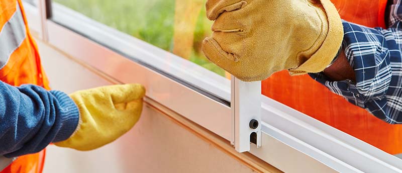 Construction workers repairing window (Construction Safety Week 2018)